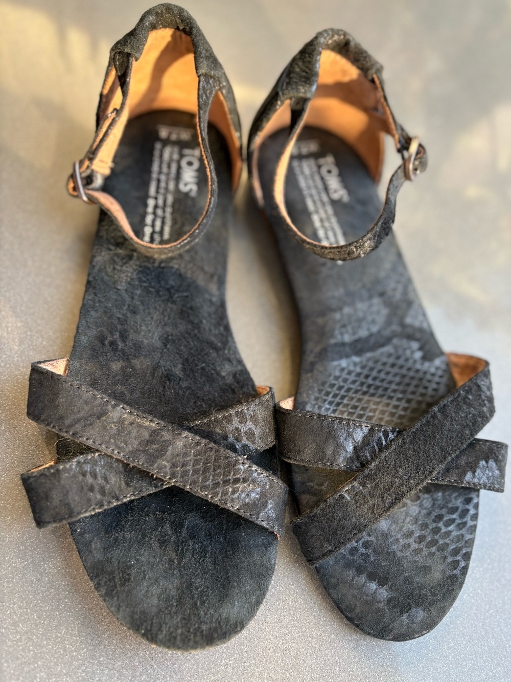 TOMS Correa sandals feature a textured snakeskin pattern.